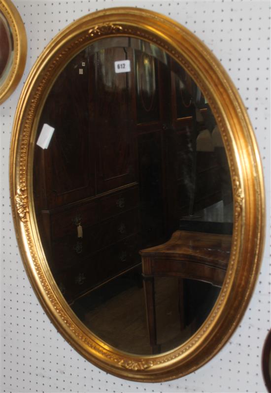 Oval gilt wall mirror